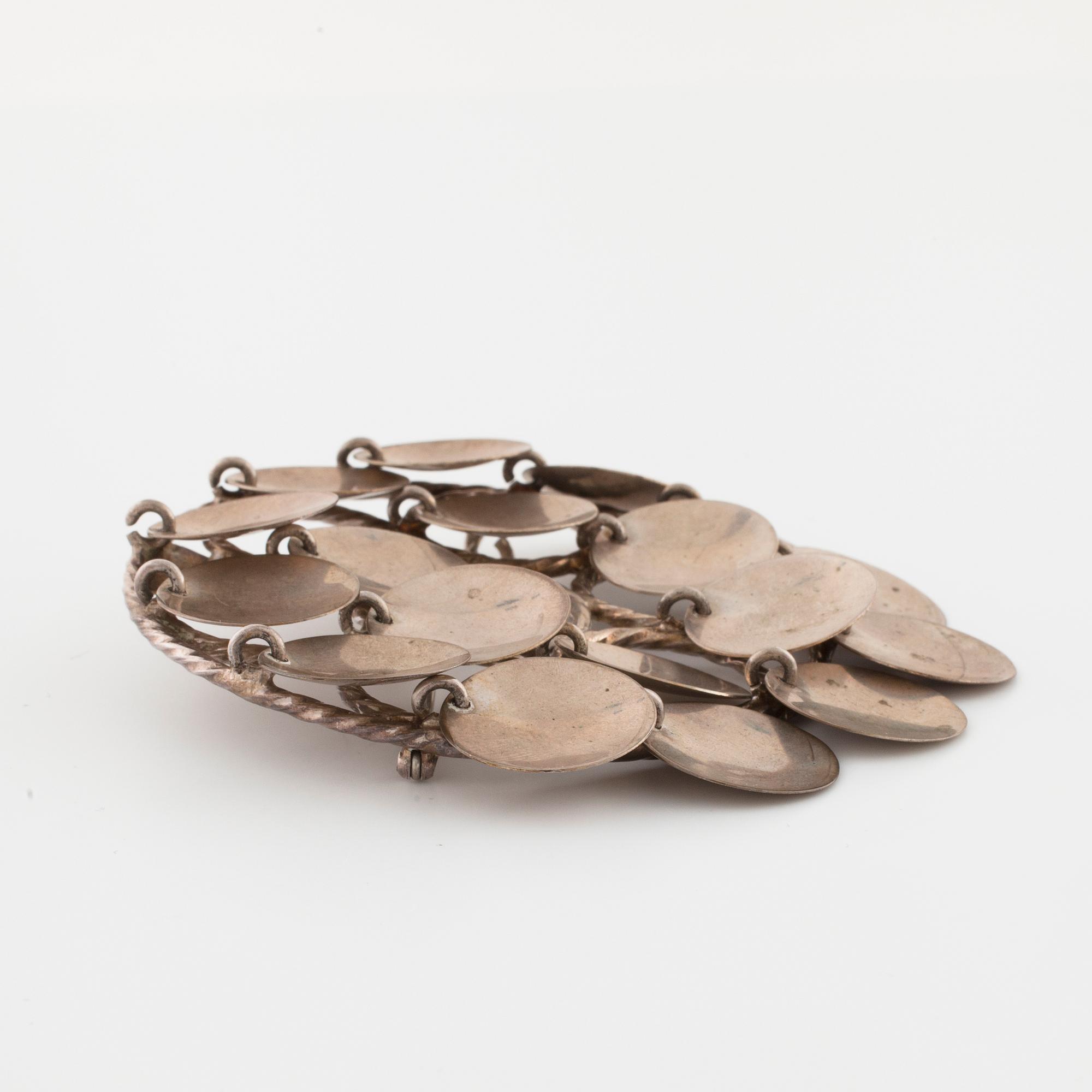 FRANK JUHLS, Kautokeino, Norway, a brooch.