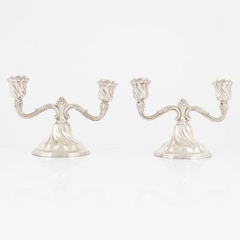 A pair of silver candelabras, first half of the 20th Century.
