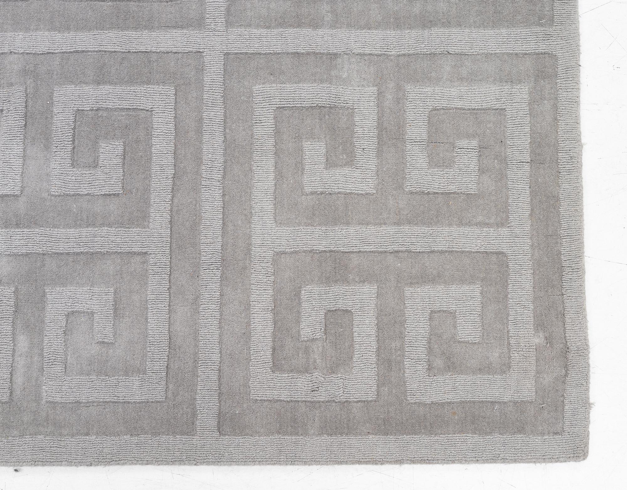 A 'Cubes' carpet, Layered, c. 270 x 180 cm.