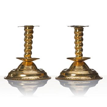 A pair of late Baroque candlesticks.