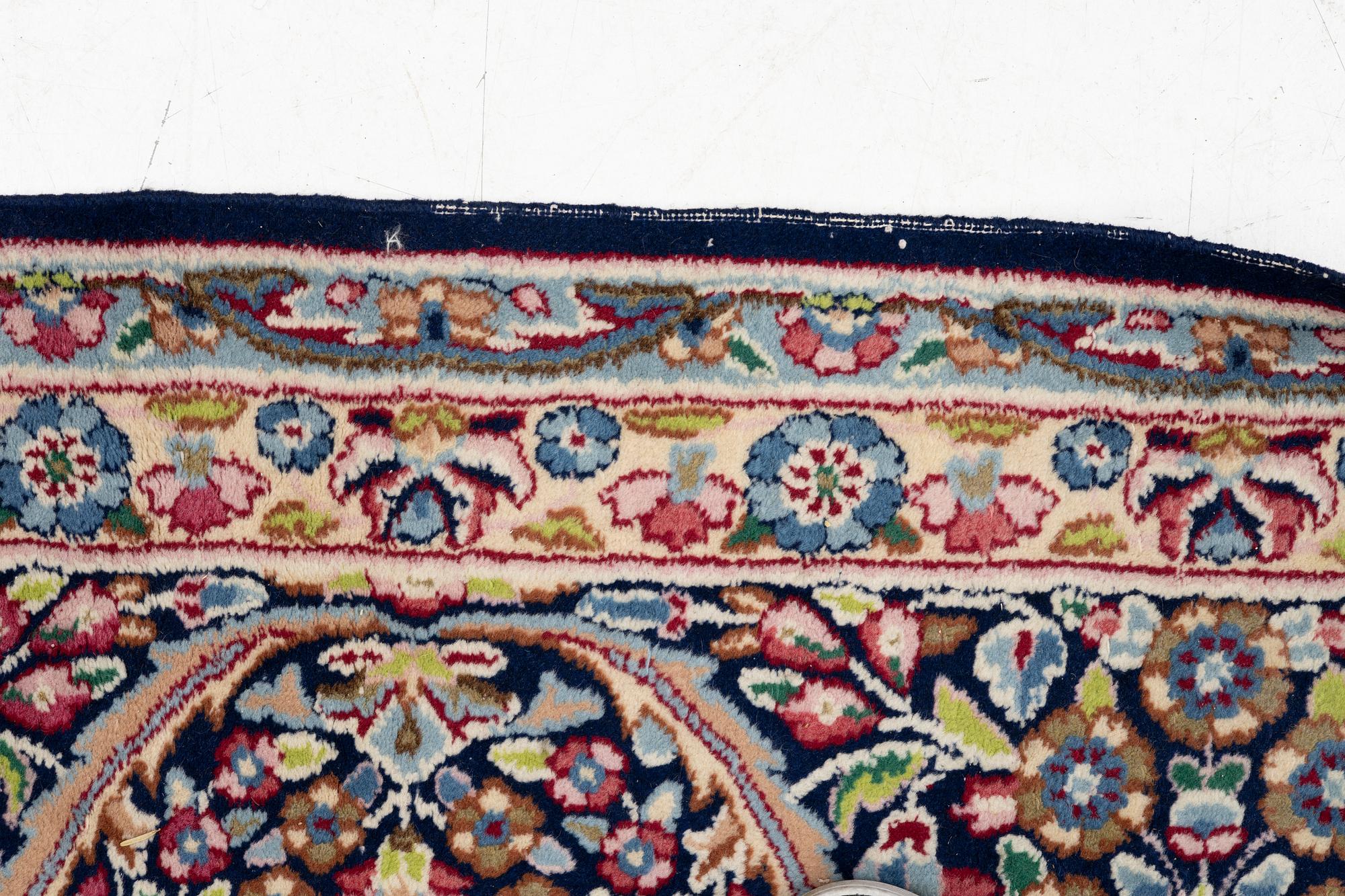 An oriental carpet, c. 385 x 300 cm.