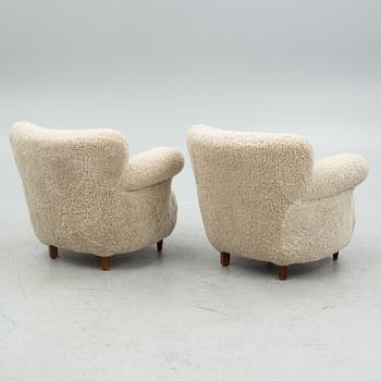 A pair of Swedish Modern easy chairs, mid 20th century.
