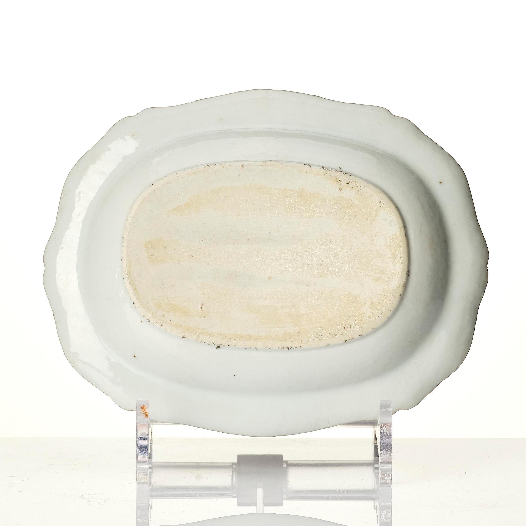 A famille rose butter tureen with cover and stand, Qing dynasty, 18th century.