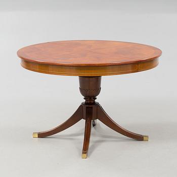 A diningroom table from the second quarter of the 20th century.