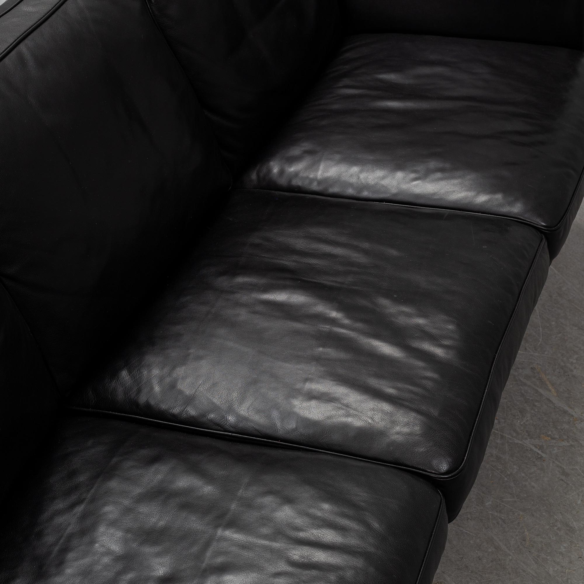 An 'AV59' sofa by Arne Vodder, Nielaus, Denmark.