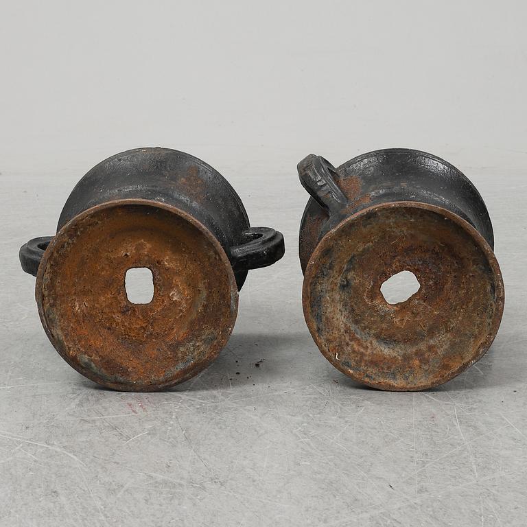 A 19th  century pair of cast iron flower pots.