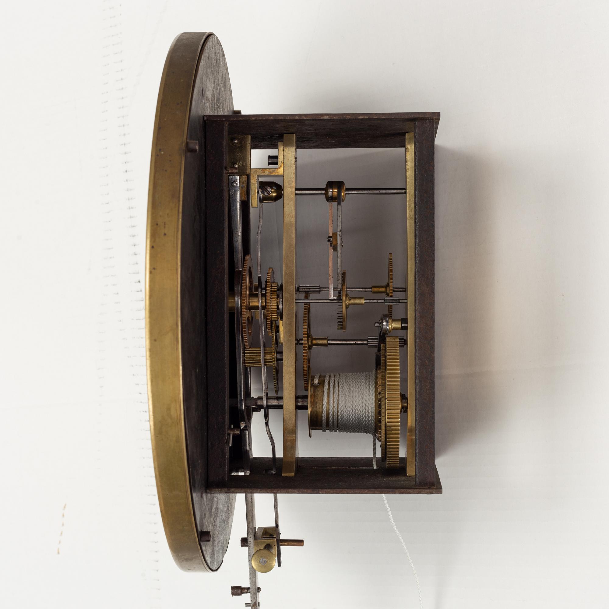 A walnut long case clock, from around the year 1900.