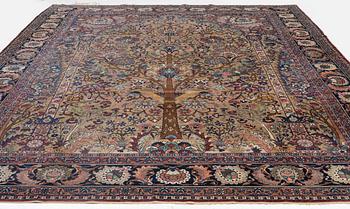 An antique/semi-antique Kerman carpet c 415 x 305 cm.