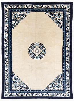 A semi-antique/old Chinese carpet, c 320 x 232 cm.