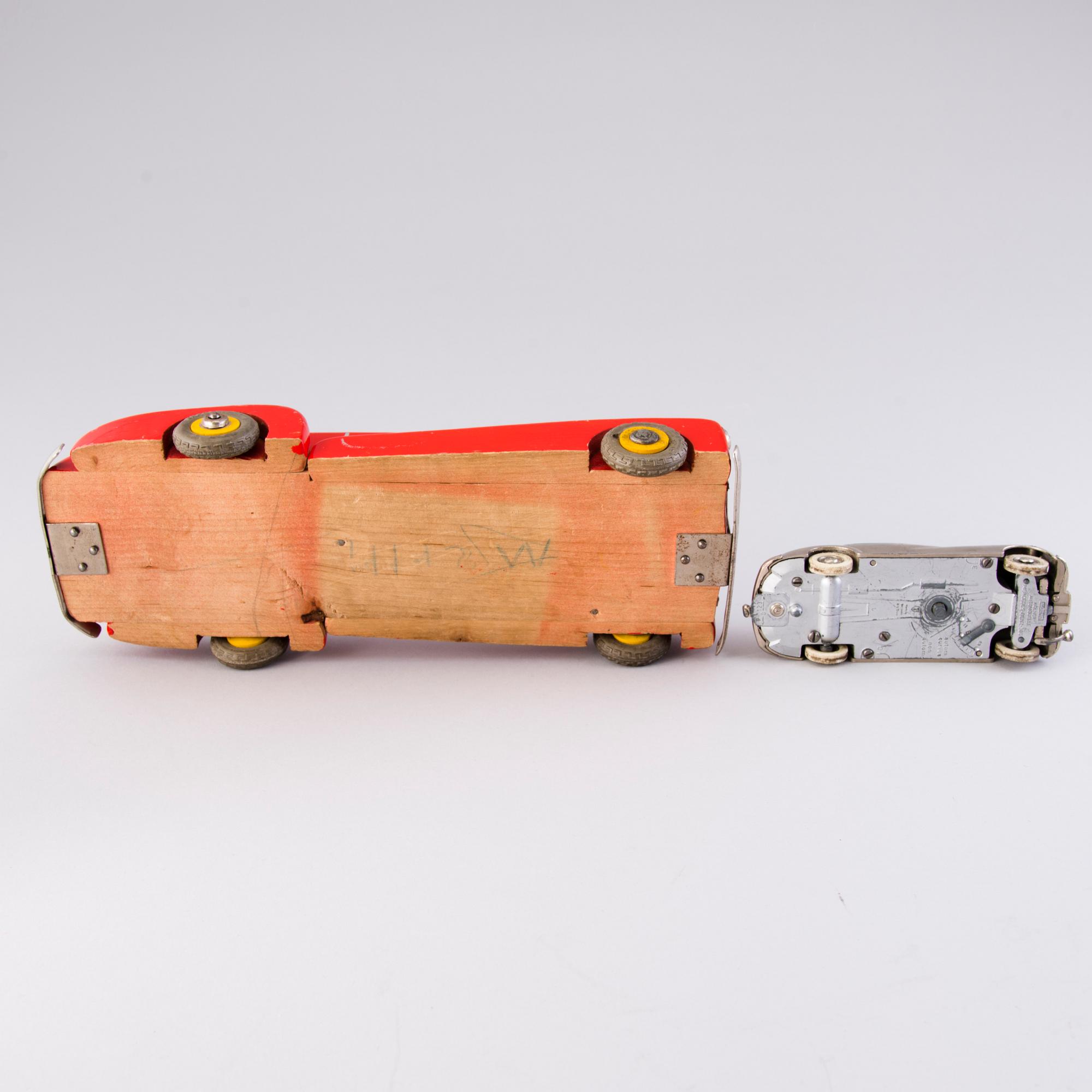 Two mid-20th century toy cars, chromed metal and wood.