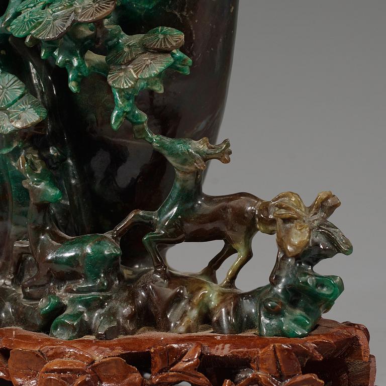 A large, Chinese carved jade pine tree with birds, 20th Century.