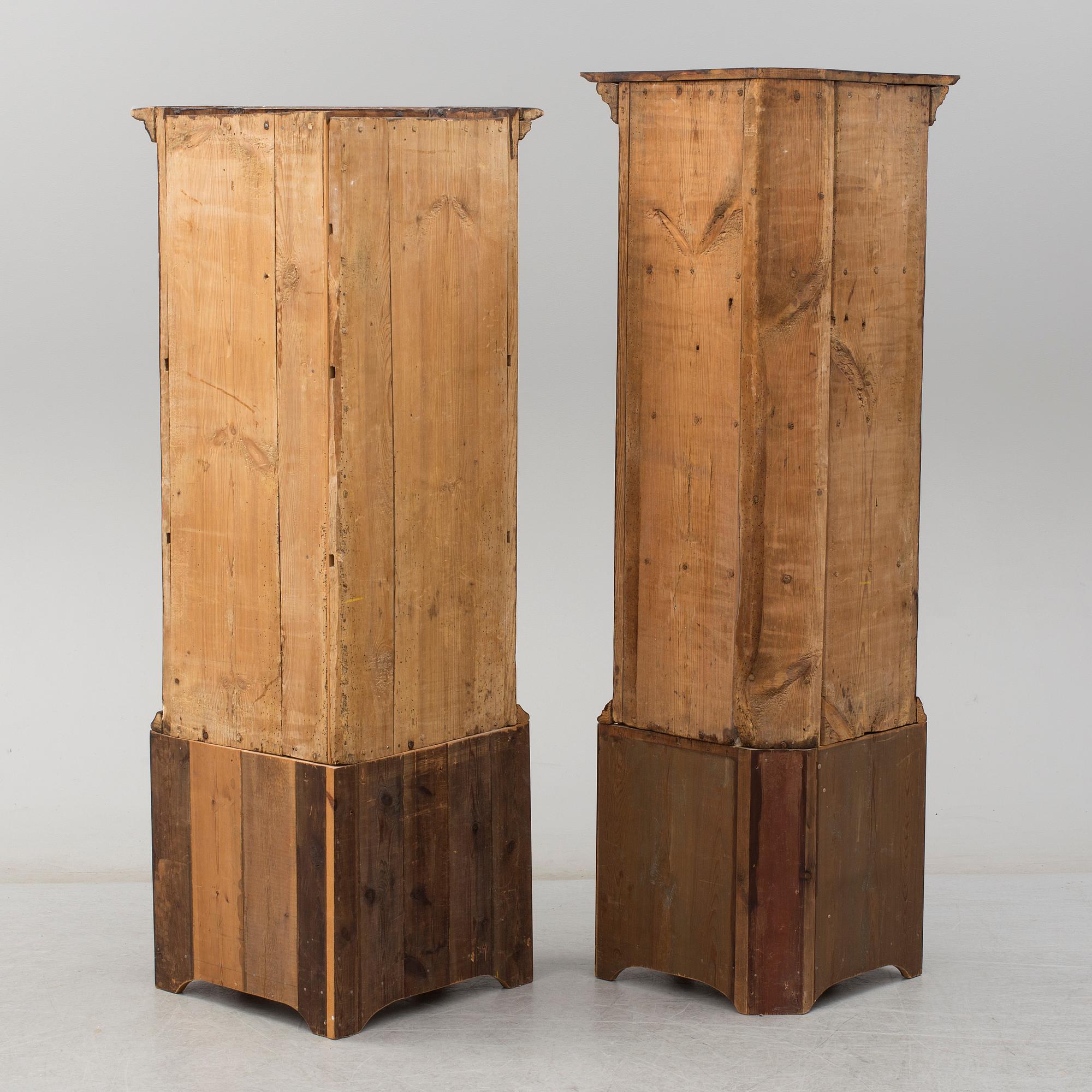 Two 18th century wooden corner cabinets.