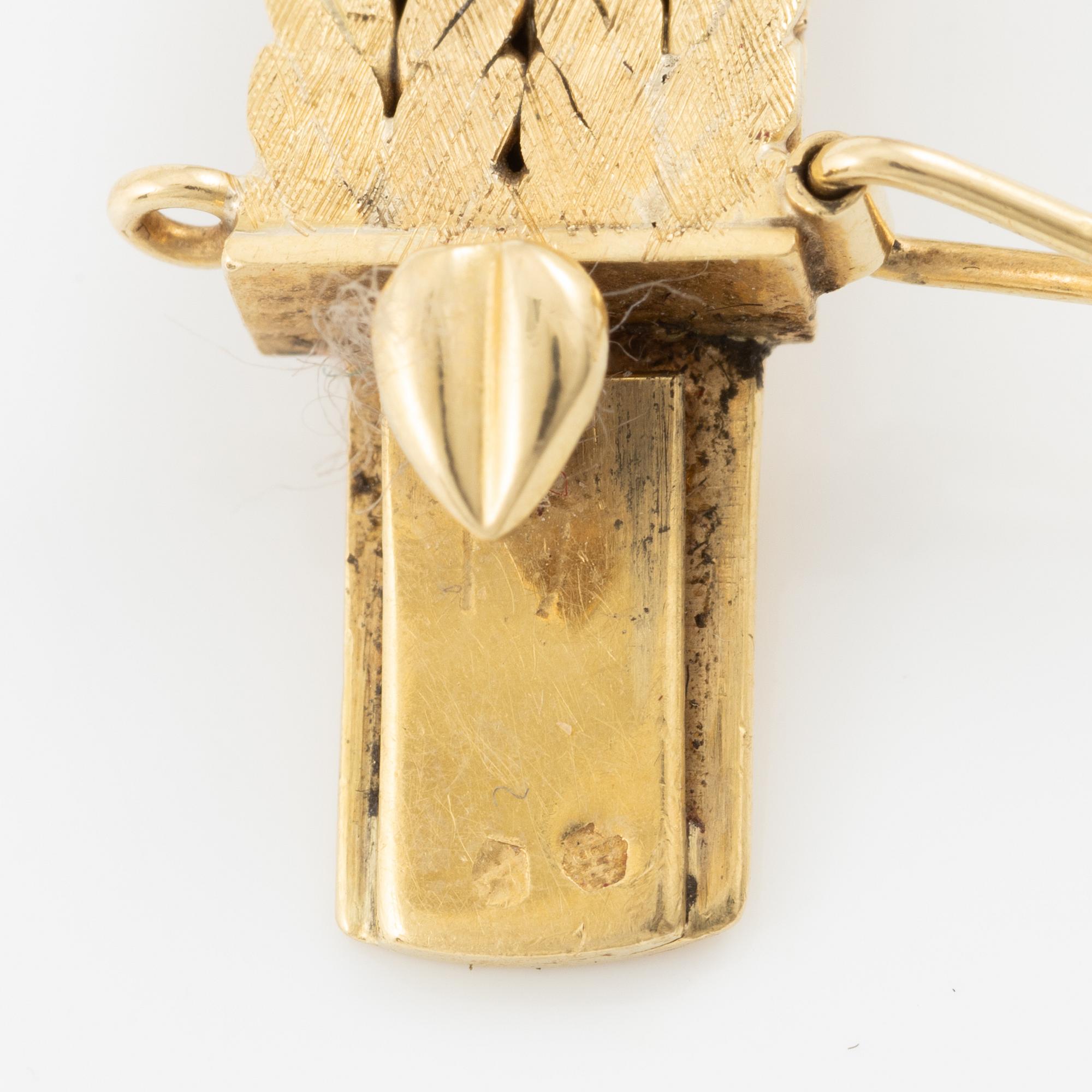 Bracelet 18K gold with rubies and brilliant-cut diamonds.