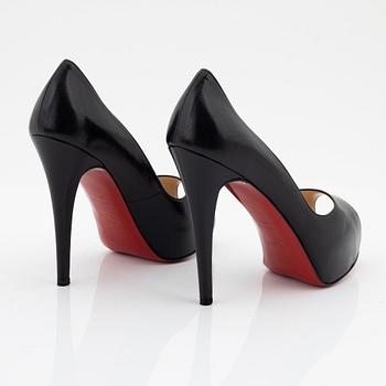 Christian Louboutin, a pair of black leather peep toe pumps, size 37 1/2.