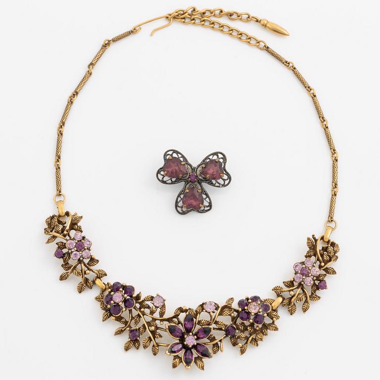 Necklace and brooch with purple stones.
