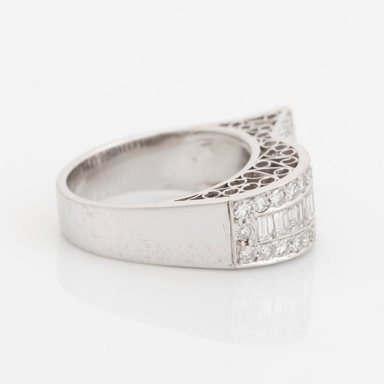 An 18K white gold ring set with baguette- and eight-cut diamonds.