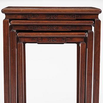A Chinese hardwood three piece nesting table, early 20th century.