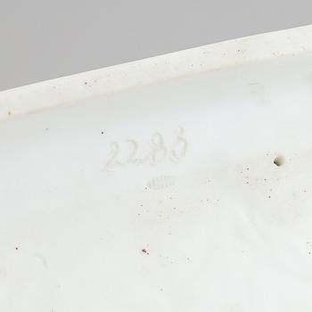 A parian figurine, 'the dying gaul', after an antique sculpture. 20th century.