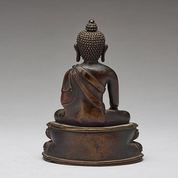 A copper alloy figure of Buddha Shakyamundi, Tibet, 17th Century.