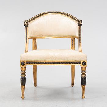 A late gustavian style armrest chair, late 19th century.