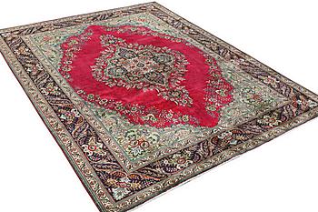 A Tabriz carpet, c. 330 x 250 cm.