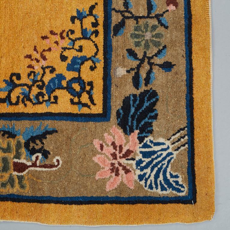 A RUG, an old China, ca 177,5 x 92,5 cm.