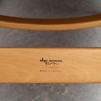 A 'Pernilla 3' lounge chair by Bruno Mathsson for Firma Karl Mathsson, dated 1973.