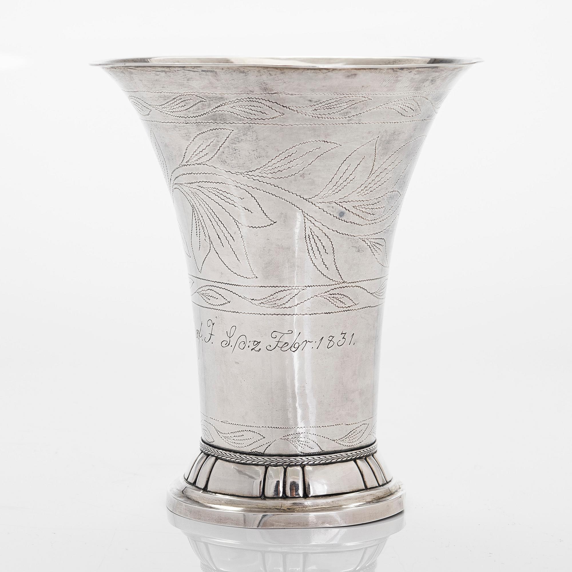 A silver beaker, maker's mark Isak Carlstedt, Porvoo ca. 1831, and silver spoon by Carl Fredrik Borgström, Turku 1803.