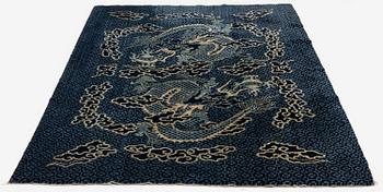 A Chinese 'dragon' rug, circa 1920. (c 190x122 cm).