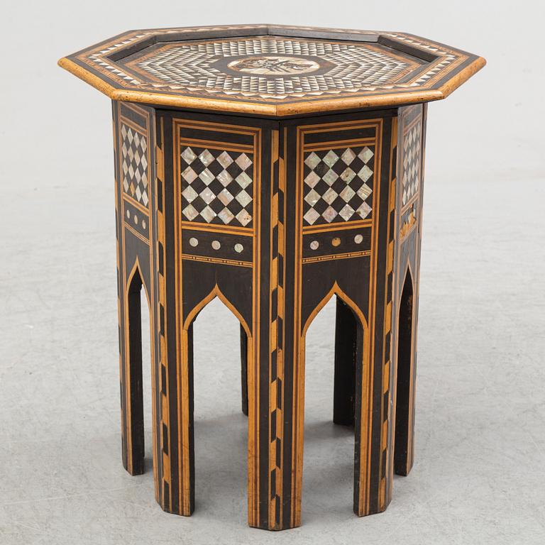 A mother of pearl and wood small table, 20th century.