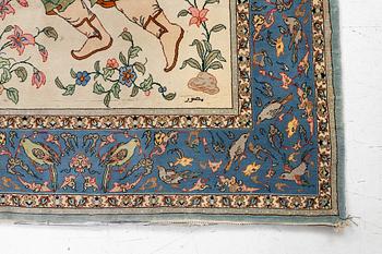 An Isfahan, figural rug, signed, c. 172 x 109 cm.