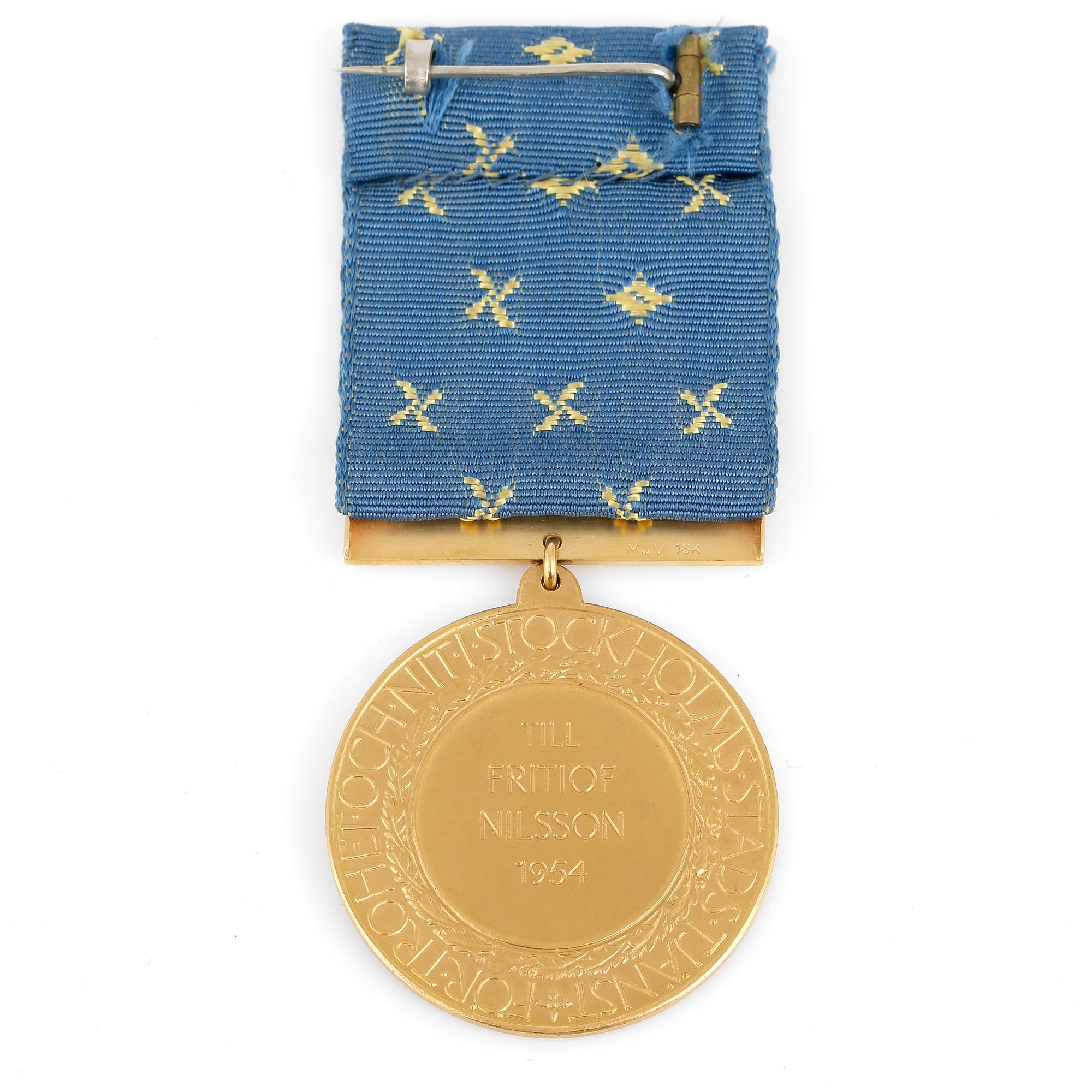 MEDALJ, 18k guld, 1954. Total vikt 31,9 gram.