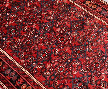 A Hosseinabad runner, c. 418 x 118 cm.