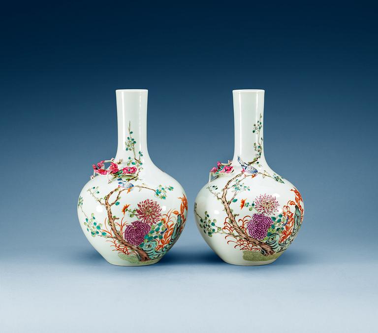 A pair of famille rose vases, first half of 20th Century, with Hongxian four character mark in red.