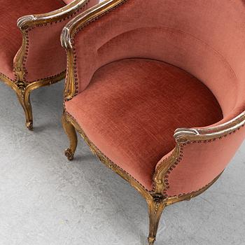 A pair of rococo style armchairs, around 1900.