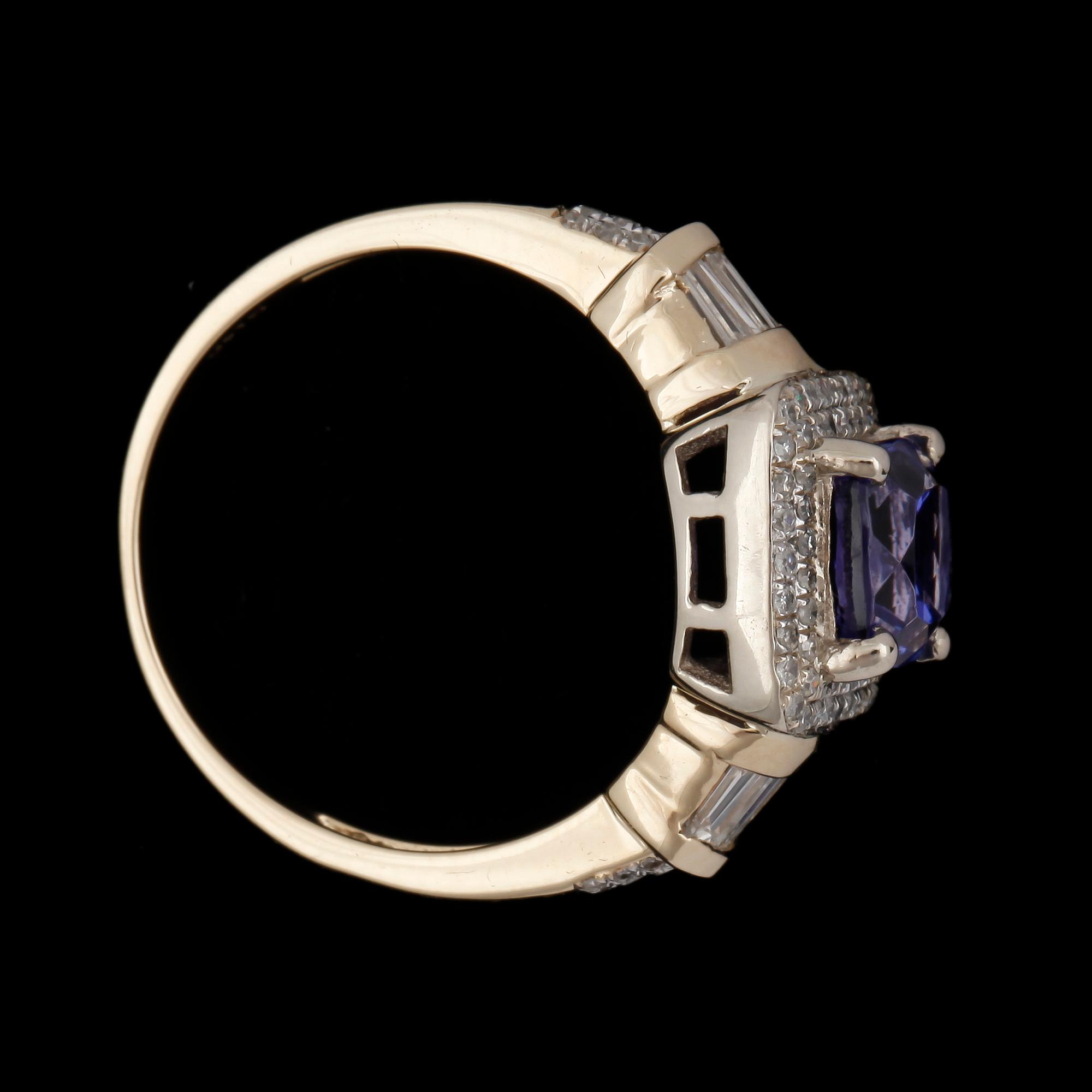 RING, 14k guld med tanzanit och små diamanter diamanter. Vikt ca 3,9 gram.