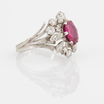 A WA Bolin ring set with a faceted pink sapphire and round brilliant- and navette-cut diamonds.