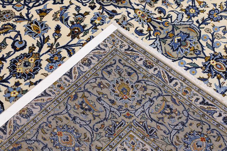 A Keshan carpet, signed, 386 x 281 cm.