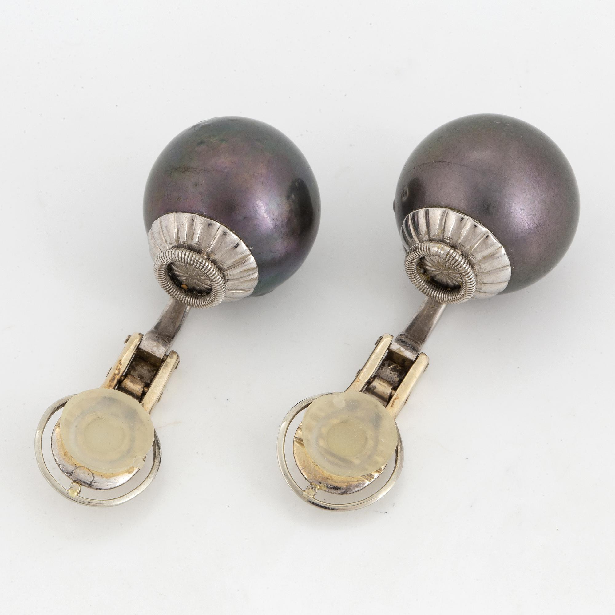 Cultured Tahiti pearl earrings.