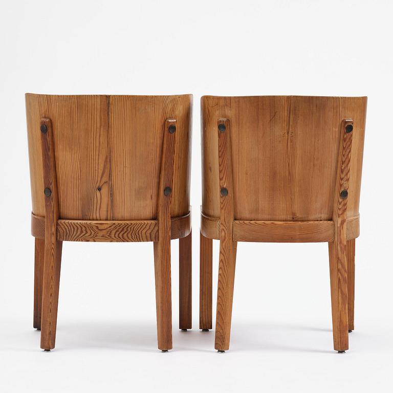 Axel Einar Hjorth, a pair of stained pine "Lovö" armchairs, Nordiska Kompaniet, Sweden, 1930s.