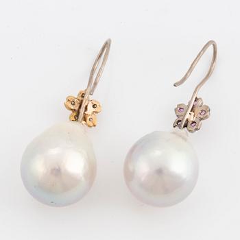 Cultured baroque South Sea pearl and pink sapphire and brilliant-cut diamond earrings.