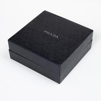 Prada, A black silk hairband.