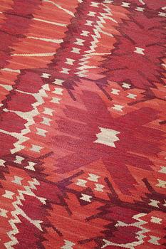 Barbro Nilsson, a carpet, "Strålblomman, röd", flat weave, ca 313,5-316 x 201,5-204,5 cm, signed AB MMF BN.