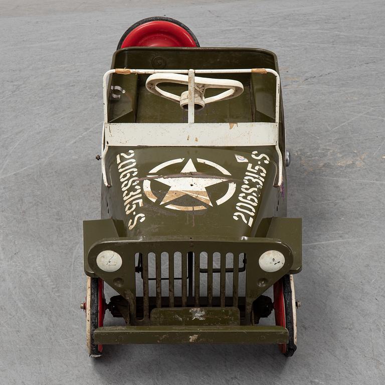 A sheet metal pedal car from the second half of the 20th century.