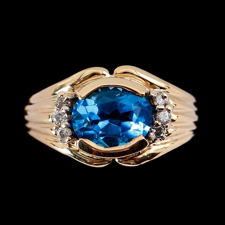 RING, 14 k guld, turkosblå topas ca 2.10 ct, diamanter tot ca 0.80 ct.