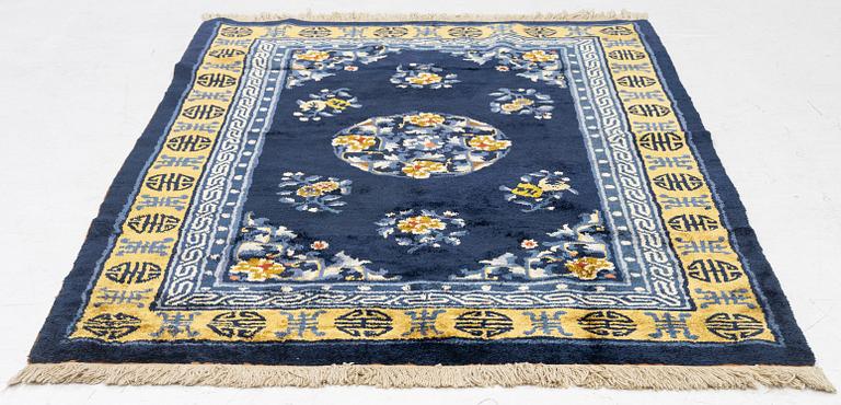 A semi-antique silk Chinaese 'Antique finish' rug, c. 175 x 122 cm.