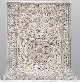 A Nain carpet, part silk, so-called 9LAA, approx. 305 x 195 cm.