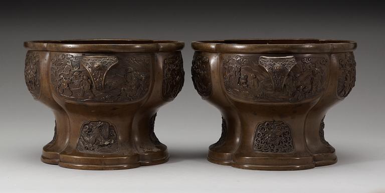 A pair of lobed bronze flower pots, Qing dynasty, with Xuandes six character mark to the interior.