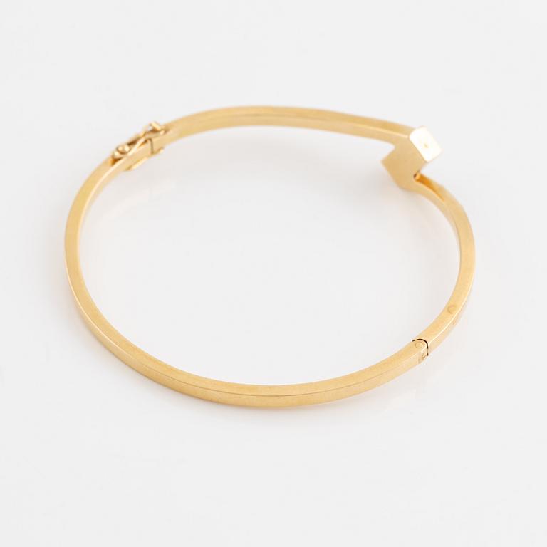 Gold and most likely natural pearl bangle.
