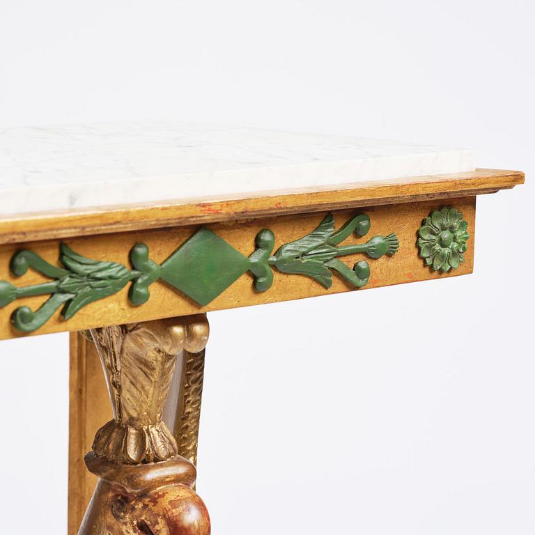A pair of giltwood console tables, Empire-style incorporating older elements.